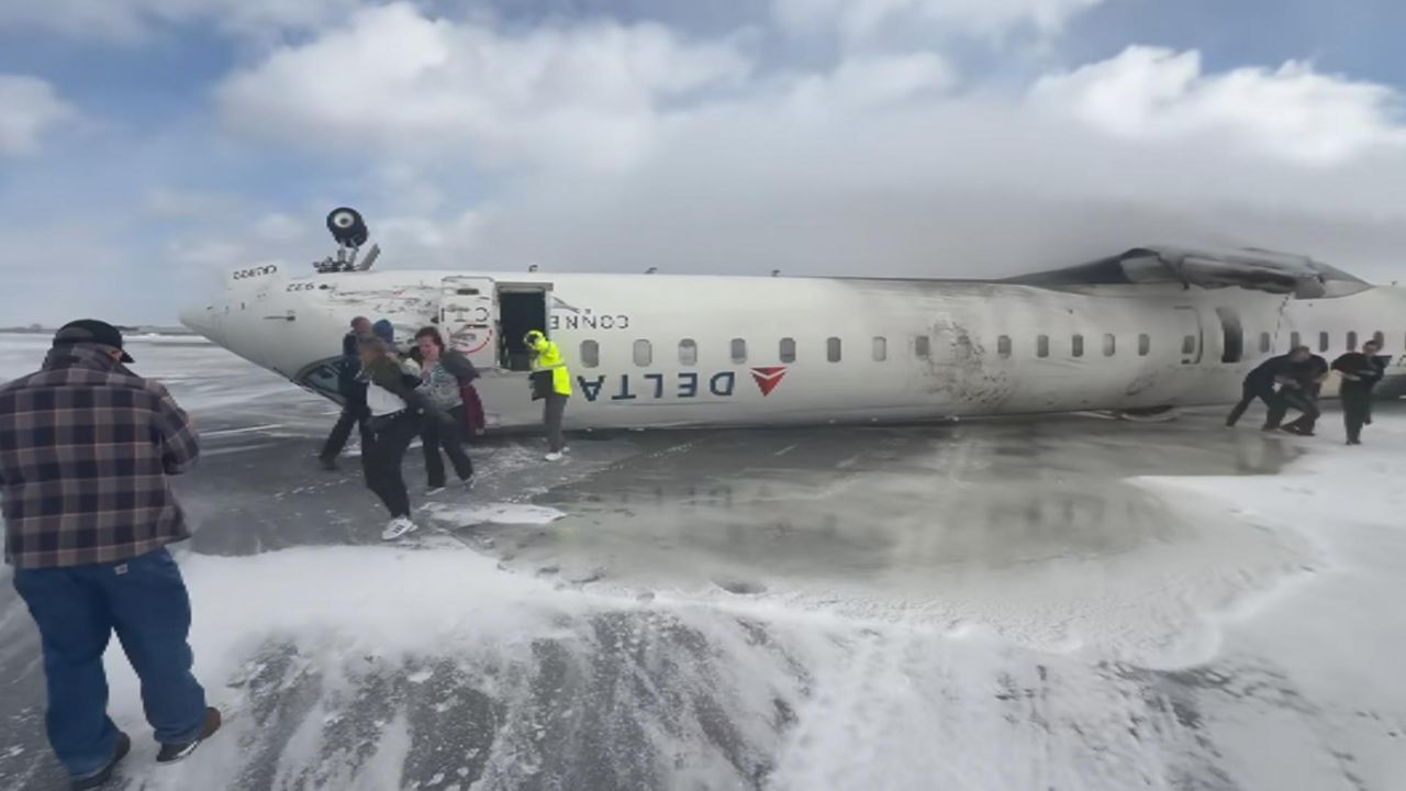 Plane crashes and flips upsidedown at Toronto airport | World News | Sky News